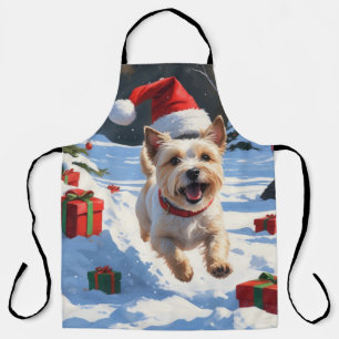 Cairn Terrier rent in de sneeuw met kerstmuts Schort