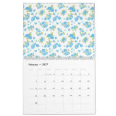Calendrier un arrière - plan blanc aux fleurs bleues et au le (Feb 2027)