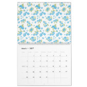 Calendrier un arrière - plan blanc aux fleurs bleues et au le (Mar 2027)