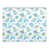Calendrier un arrière - plan blanc aux fleurs bleues et au le (Protection)
