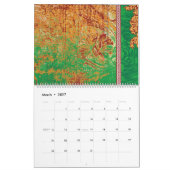 Calendrier un tableau d'un champ vert avec une bordure orange (Mar 2027)