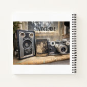  camera's en  afdrukken notitieboek (Achterkant)