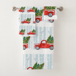 Camion pick-up rouge de Noël sur une route de