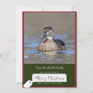 Canard en bois sur une carte de Noël