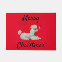 Caniche blanche sur tapis rouge Noël