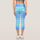 Capri A person wearing vibrant blue leggings adorned  (Verso)