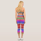 Capri A woman wears vibrant, zigzag-patterned leggings  (Verso)