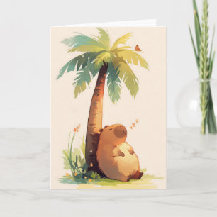 Capybara die een dutje doet onder een palmboom kaart