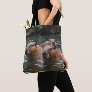 Capybaras' zwemmen in de rivier, draagtas
