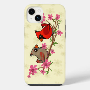 Cardinaux boréaux sur une branche en fleurs