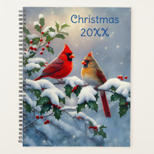 Cardinaux rouges et houx dans la neige