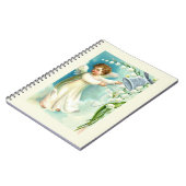 Carnet Bébé ange avec cloche bleue  (Côté gauche)