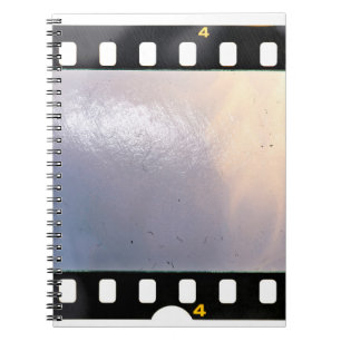 Carnet Blank 35mm film frame or strip on white background