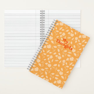Carnet Des motifs floraux doux d'un arrière - plan orange