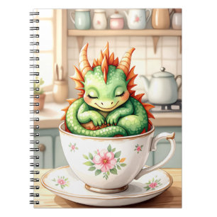 Carnet Dragon de bébé confortable dans une tasse de thé