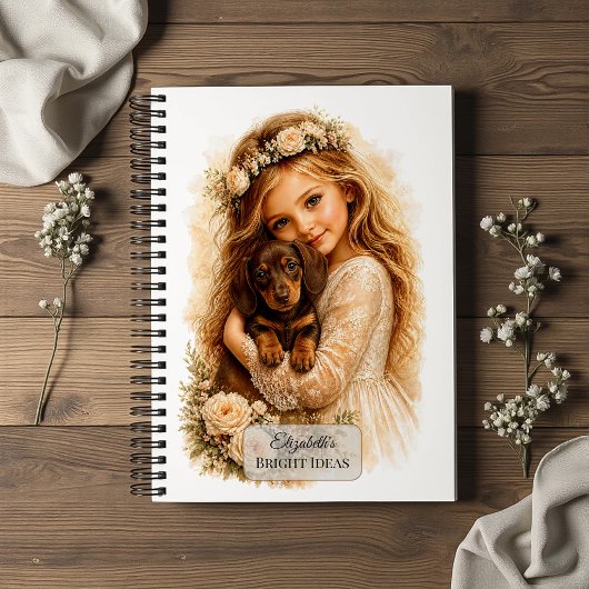 Carnet Fille serrant un chiot teckel dans ses bras