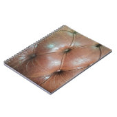 Carnet Lumière sur la surface du canapé en cuir marron, t (Côté gauche)