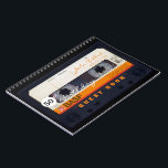 Carnet Orange Retro Audiotape 50th birthday GuestBook NB<br><div class="desc">Old audio cassette to personalize with your name and date. Design on spiral notebook with text for 50th Birthday party guest book in horizontal orientation. You can easily change text (font, color, size and position) by clicking the customize button. Available in hard cover guest book. Matching birthday save the date...</div>