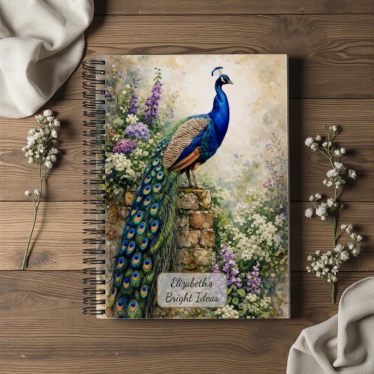 Carnet Paon dans un jardin fleuri