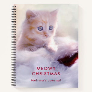 Carnet Petit Kitten reposant sur un chapeau de Noël Meowy