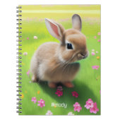 Carnet Un mignon lapin dans une prairie fleurie (Devant)