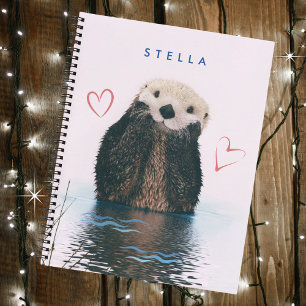 Carnet Une loutre mignonne dans un étang avec un fond ros