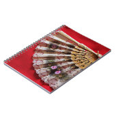 Carnet Ventilateur à main orné sur un Arrière - plan roug (Côté gauche)