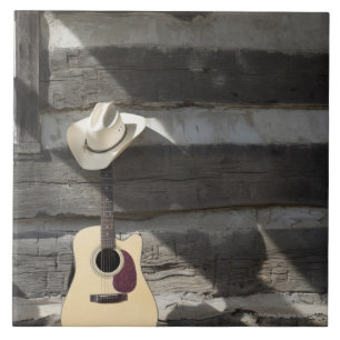 Carreau Casquette de cowboy sur la guitare se penchant sur