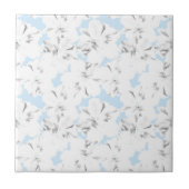 Carreau Fleurs blanches sur bleu clair. (Devant)