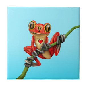 Carreau Jour rouge de la grenouille d'arbre morte de crâne