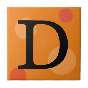 CARREAU MONOGRAMME ORANGE ET TITRES POIS