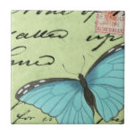 Carreau Papillon à ailes bleues sur carte postale Turquois<br><div class="desc">Cette carte postale turquoise porte un message de beauté. Un délicat papillon à ailes bleues repose sur la carte,  obscurcissant une partie du script qu'il contient. Cette impression de Vision Studio ferait un grand ajout à votre maison!</div>