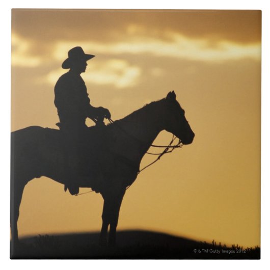 Carreau Silhouette de cowboy à cheval au coucher du soleil (Devant)