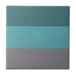 Carreau Turquoise, Gris<br><div class="desc">Un motif rayé gris et turquoise avec des bandes larges et horizontales formant une image géométrique colorée.</div>