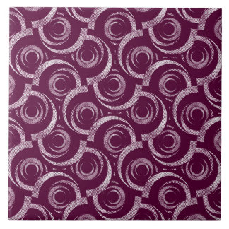 Carreau White ornament on a burgundy background.