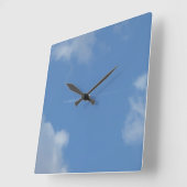 Carrée horloge ciel bleu avion trace (Angle)