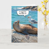 Carte 75e anniversaire Humour Mouette perchée sur un lio (Fleur jaune)