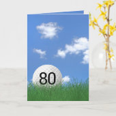 Carte 80e anniversaire, balle de golf dans l'herbe (Fleur jaune)