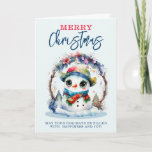 Carte Aquarelle Snowman<br><div class="desc">Une image aquarelle d'un mignon Snowman portant une écharpe et un casquette,  avec de grands yeux,  sur une couronne de Noël</div>