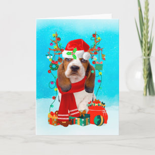 Carte Basset Hound dans la neige avec cadeaux de Noël