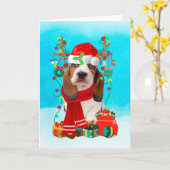 Carte Basset Hound dans la neige avec des cadeaux de Noë (Fleur jaune)