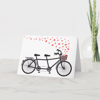Carte bicyclette tandem avec des cœurs rouges