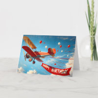 Biplane vintage avec bannière d'anniversaire