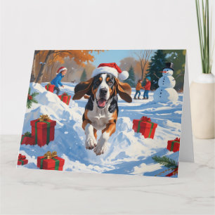 Carte Bluetick Coonhound courant dans la neige avec Noël