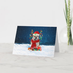 Carte Bouledogue anglais dans la neige avec des cadeaux 