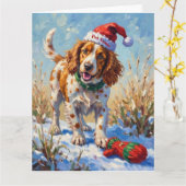 Carte Brittany Spaniel Pointing at Santa's Glove Hat (Fleur jaune)