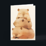 Carte Capybara Cuddling<br><div class="desc">Cette charmante carte de voeux est ornée d'une adorable pile de trois capybaras qui dorment, chacun niché au sommet de l'autre dans une tour douillette de gentillesse. Les tons doux et pastel et le design fantaisiste saisissent la nature douce et ludique de ces animaux bien-aimés, ce qui rend cette carte...</div>