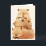 Carte Capybara Cuddling<br><div class="desc">Cette charmante carte de voeux est ornée d'une adorable pile de trois capybaras qui dorment, chacun niché au sommet de l'autre dans une tour douillette de gentillesse. Les tons doux et pastel et le design fantaisiste saisissent la nature douce et ludique de ces animaux bien-aimés, ce qui rend cette carte...</div>