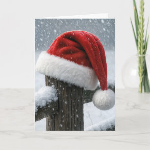 Carte Chapeau de Père Noël sur un poteau de clôture enne