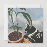 Chat regardant les plantes d'intérieur